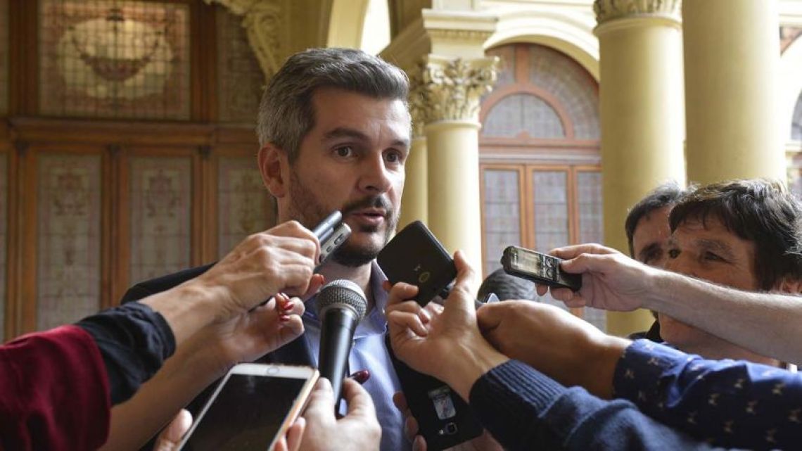 Cabinet Chief Marcos Peña speaks to reporters.