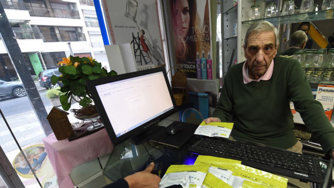 Enrique Curbelo sells marijuana at his pharmacy in Montevideo.