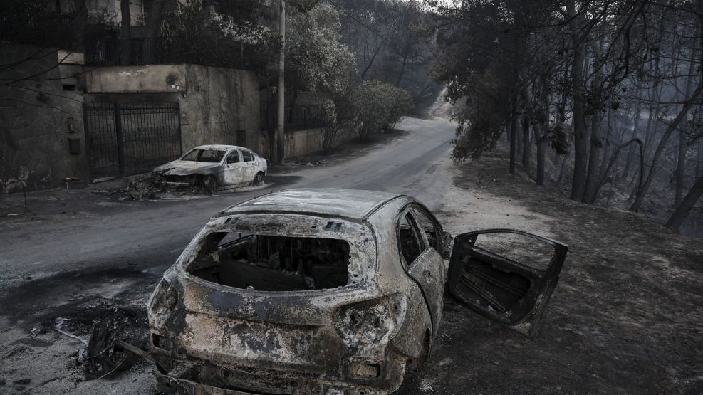 Burnt automobile shells line the streets following a wildfire