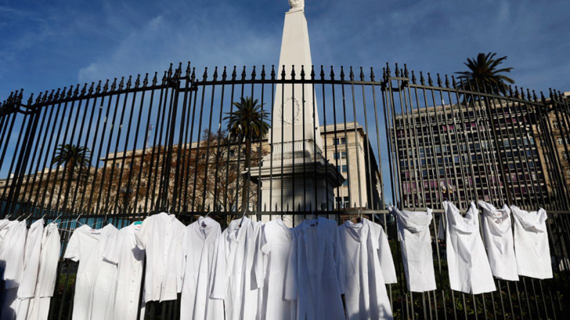 White medical coats hang from the iron gate that surrounds the national May Pyramid monument, as a symbolic act by the Doctors for Life campaign group against efforts to legalise abortion.