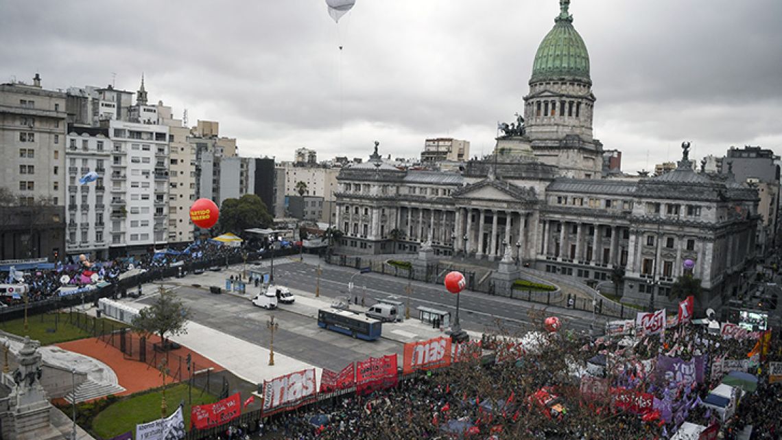 Activists in favour (right) and against (left) the abortion reform bill gather to demonstrate, close to the national Congress building in Buenos Aires.