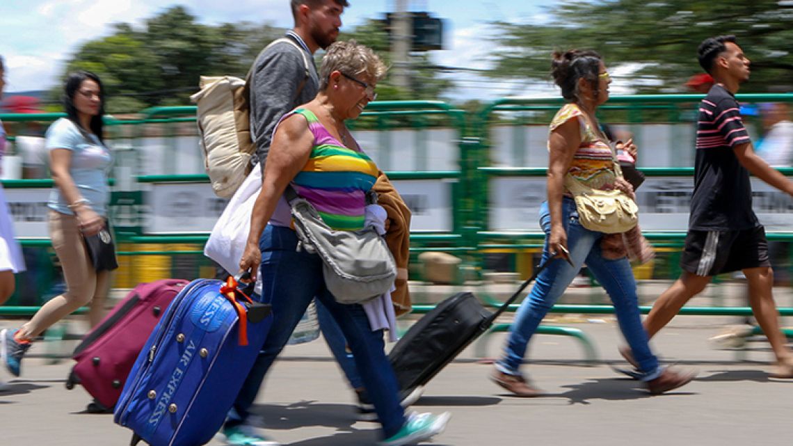 Venezuelans cross the border from San Antonio del Táchira in Venezuela into Cucuta, in Norte de Santander Department, Colombia, through the Simón Bolívar international bridge.
