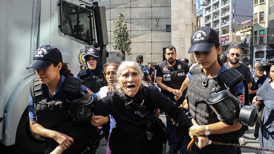 Riot police in Istanbul break up a regular demonstration by Turkish mothers remembering the disappearance of relatives in the 1980s and 1990s, detaining dozens as they marked holding the 700th such weekly protest.