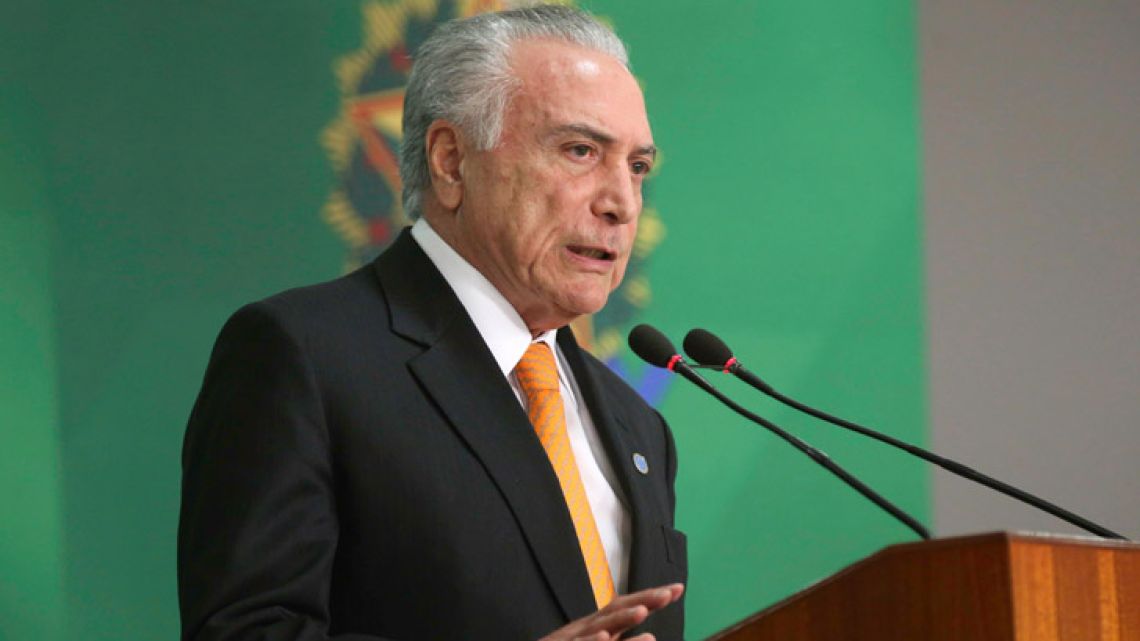 Handout picture released by Agencia Brasil showing Brazilian President Michel Temer announcing Brazil is sending troops to reinforce security on the border with Venezuela, at the Planalto Palace in Brasilia on August 28, 2018.