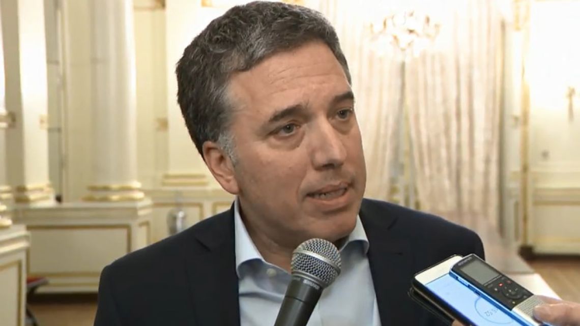 Screengrab taken from a handout video released by Argentina's Presidency showing Argentina's Economy Minister Nicolas Dujovne offering a press conference at the Casa Rosada presidential palace in Buenos Aires, on August 30, 2018. Argentina's Central Bank hiked its benchmark interest rate from 45 to 60 percent on Thursday in a dramatic but fruitless bid to shore up the peso, which plunged to a record low against the dollar. Despite the bank's extraordinary measure to impose one of the world's highest benchmark rates, the currency lost a further 13.5 percent by the close -- its biggest daily loss of the year.  