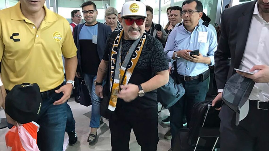 Diego Maradona walks through Culiacan airport in Mexico.