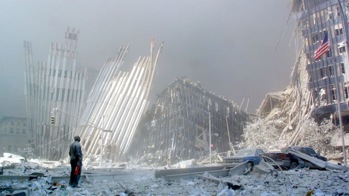 In this photo taken on September 11, 2001, a man stands in the rubble after the collapse of the first World Trade Center Tower in New York. Seventeen years later, more than 1,100 victims of the hijacked plane attacks on the World Trade Center have yet to be identified. But in a New York lab, a team is still avidly working to identify the remains, with technological progress on its side. Day in, day out, they repeat the same protocol dozens of times.