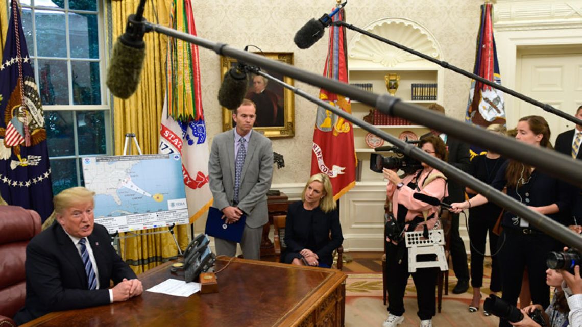 US President Donald Trump talks about Hurricane Florence, during a briefing in the Oval Office.