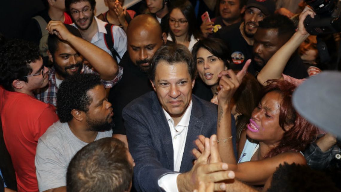 Fernando Haddad greets students during an event in São Paulo.