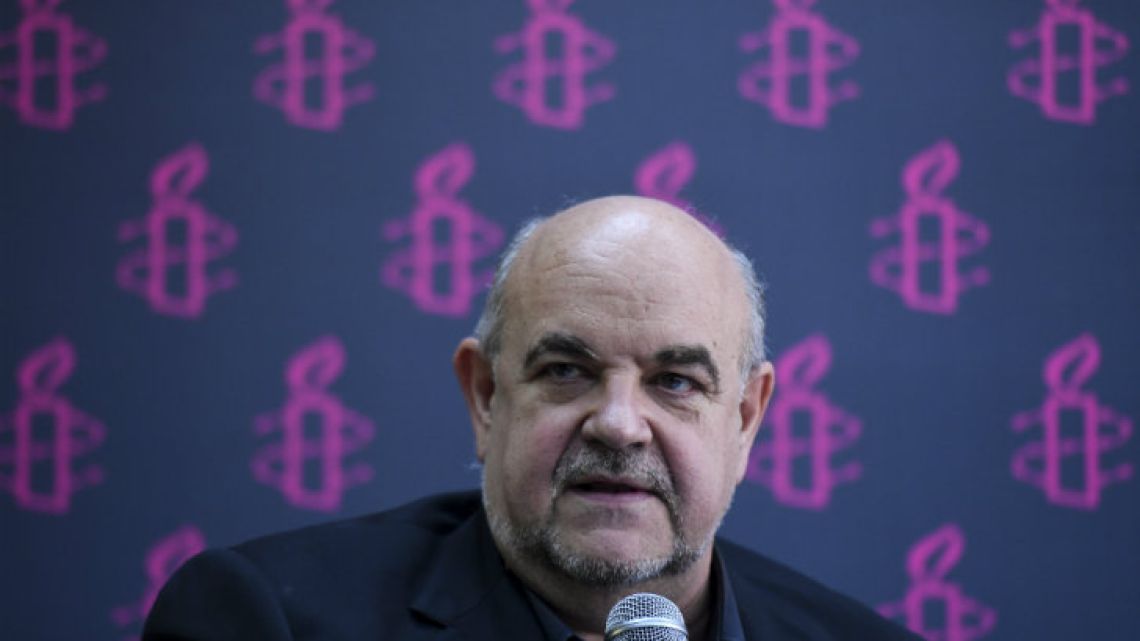 Director of Amnesty International Spain Esteban Beltran presents a report on violence in Venezuela during a press conference in the capital on Thursday.