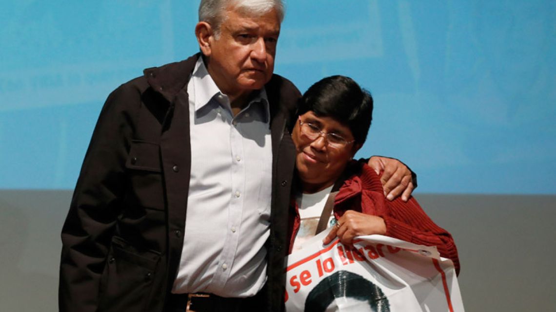 Mexico's President-elect Andrés Manuel López Obrador and María Elena Guerrero, mother of one of the 43 college students who disappeared on September 26, 2014, at the Memory and Tolerance Museum in Mexico City on Wednesday, September 26, 2018.