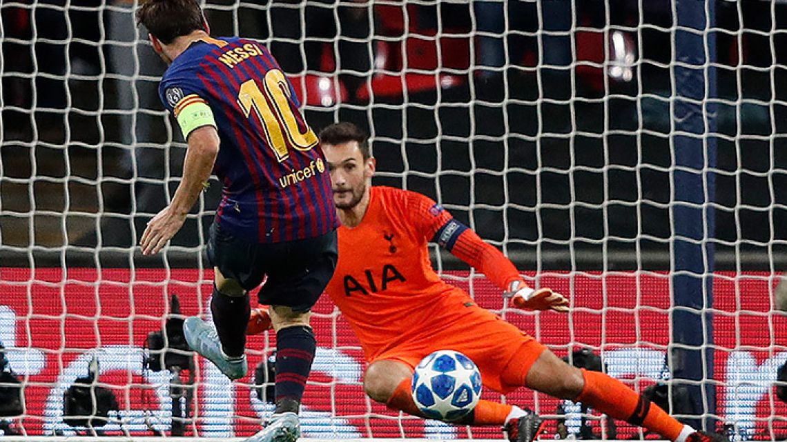 Barcelona forward Lionel Messi scores his team's fourth, and his second, goal past Tottenham Hotspur's French goalkeeper Hugo Lloris during the Champions League Group B football match at Wembley Stadium in London, on October 3, 2018.