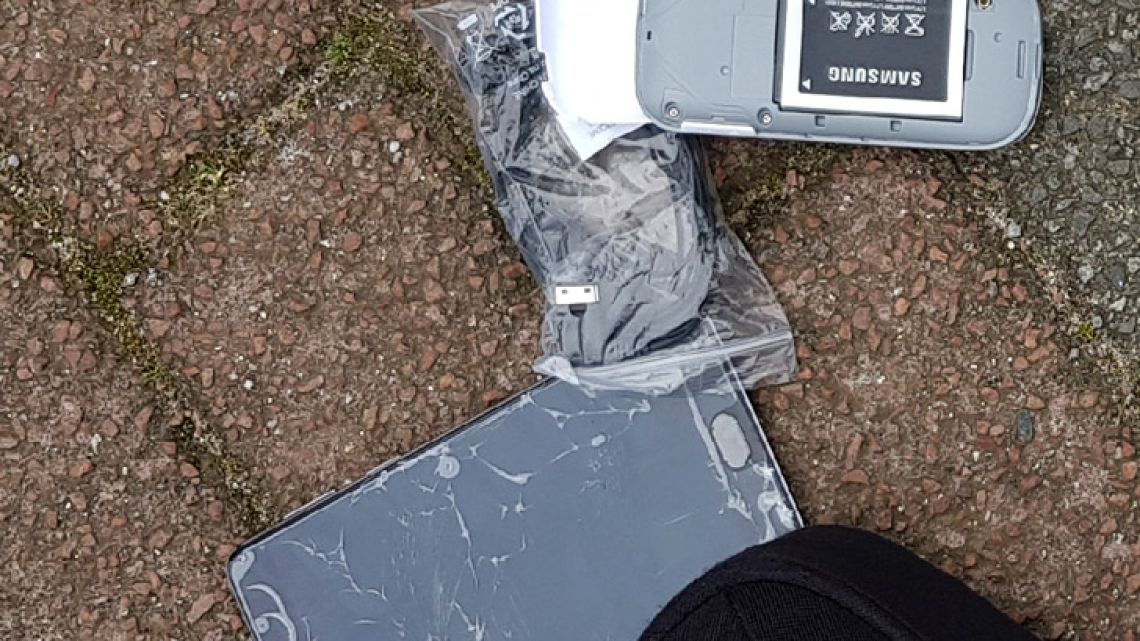 In this image released by the Dutch Defence Ministry on October 4, one of the many phones belonging to four Russian officers of the Main Directorate of the General Staff of the Armed Forces of the Russian Federation, GRU, is seen after one of the four officers tried to destroy it when they were caught on April 13, 2018. 