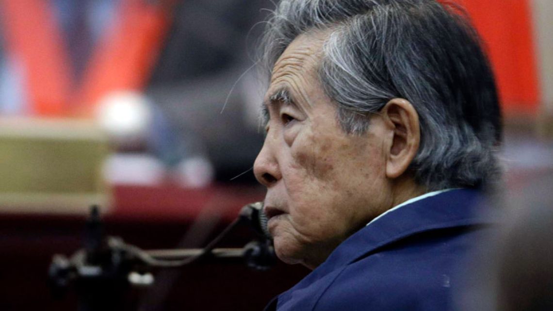Peru's former President Alberto Fujimori listens to a question during his testimony in a courtroom at a military base in Callao, Peru. 