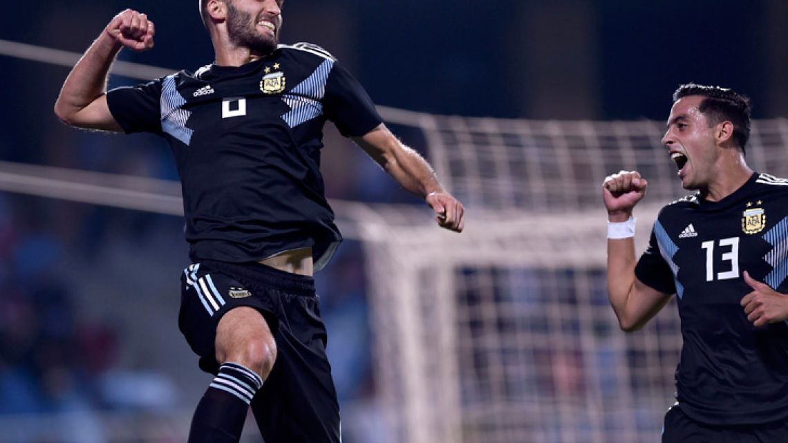 German Pezzella, left, celebrates scoring Argentina's third goal with his teammate Ramiro Funes Mori.