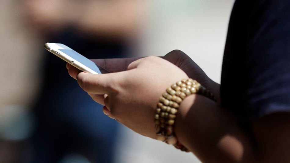 Mobile Phone Users And Stores As NTT DoCoMo Inc. Leads Plunge After Abe Calls For Lower Phone Bills