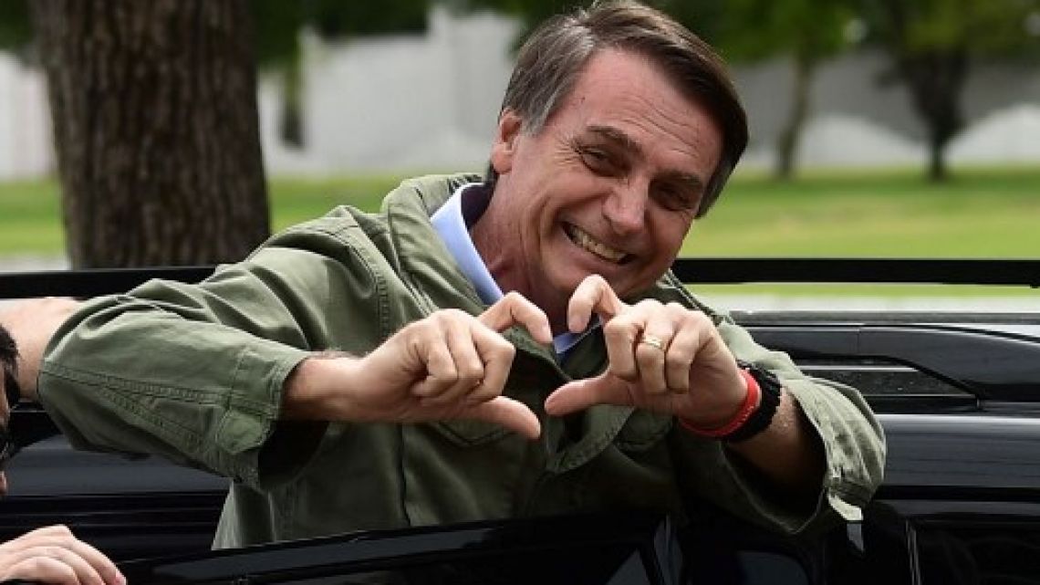 Jair Bolsonaro, far-right lawmaker and presidential candidate for the Social Liberal Party (PSL), gestures to supporters during the second round of the presidential elections, in Rio de Janeiro, Brazil on October 28, 2018. 