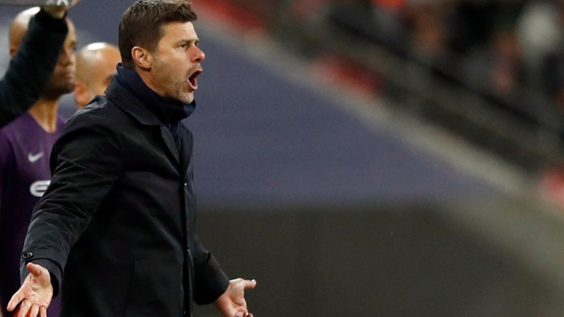 Tottenham manager Mauricio Pochettino reacts on the sidelines as he watches his players during the English Premier League soccer in London, England.