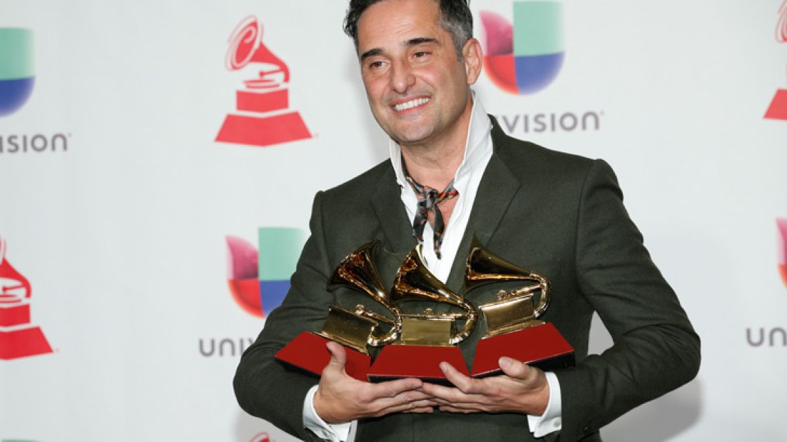 Jorge Drexler poses in the press room with the awards for best singer-songwriter album for "Salvavidas De Hielo," song of the year and record of the year for "Telefonia" at the Latin Grammy Awards on Thursday, Nov. 15, 2018, at the MGM Grand Garden Arena in Las Vegas. 