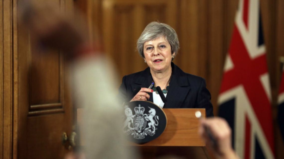 Britain’s Prime Minister Theresa May reacts during a press conference inside 10 Downing Street.