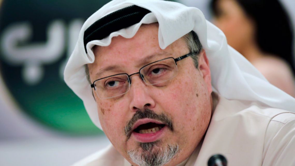 Saudi journalist Jamal Khashoggi speaks during a press conference in Manama, Bahrain, in December 2014. 