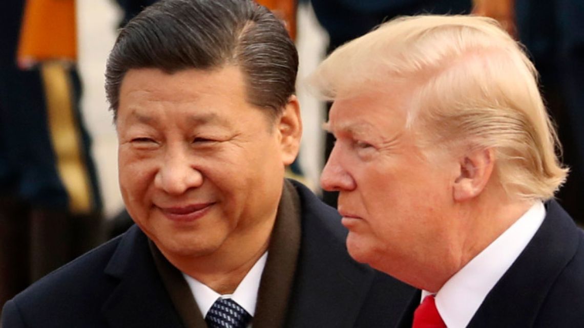 U.S. President Donald Trump and Chinese President Xi Jinping participate in a welcome ceremony at the Great Hall of the People in November 2017 in Beijing, China. 