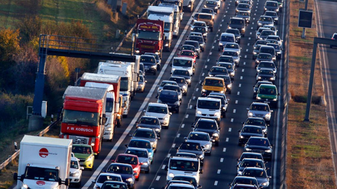 Cars and trucks queue on the highway A5 in Frankfurt, Germany. 