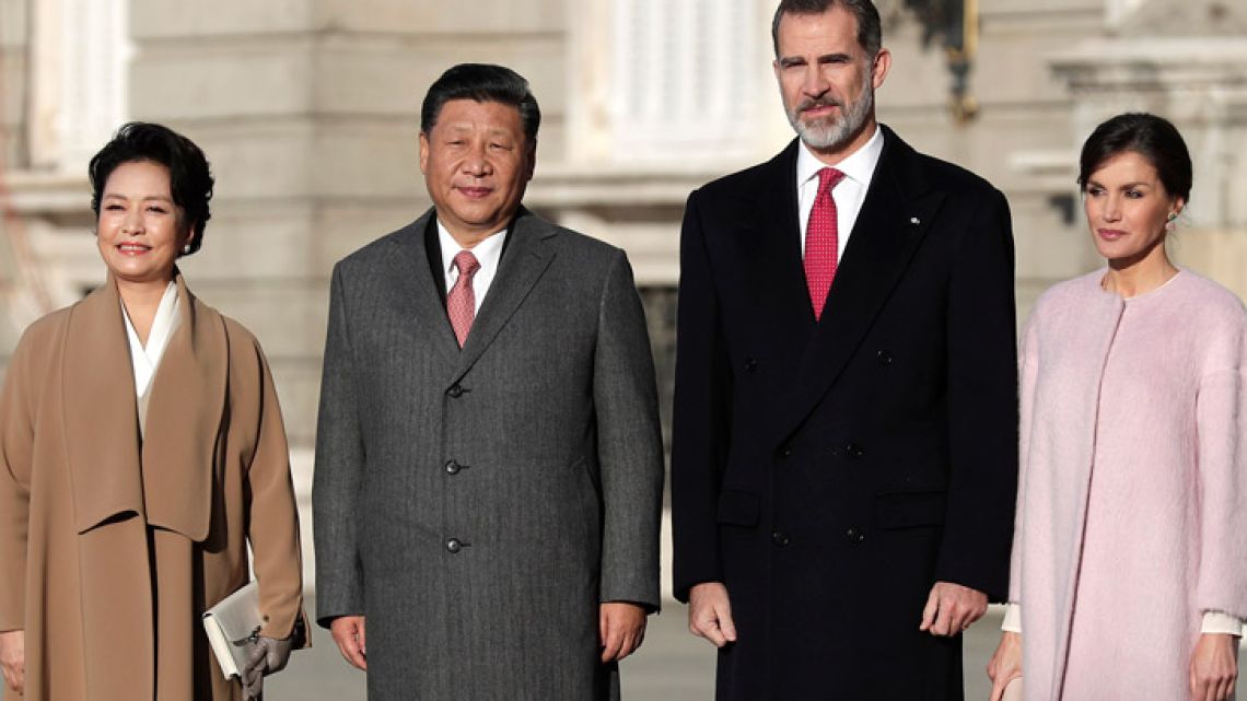 Chinese President Xi Jinping poses with Spain's King Felipe together with their wives during a welcome ceremony at the Royal Palace in Madrid, Spain.