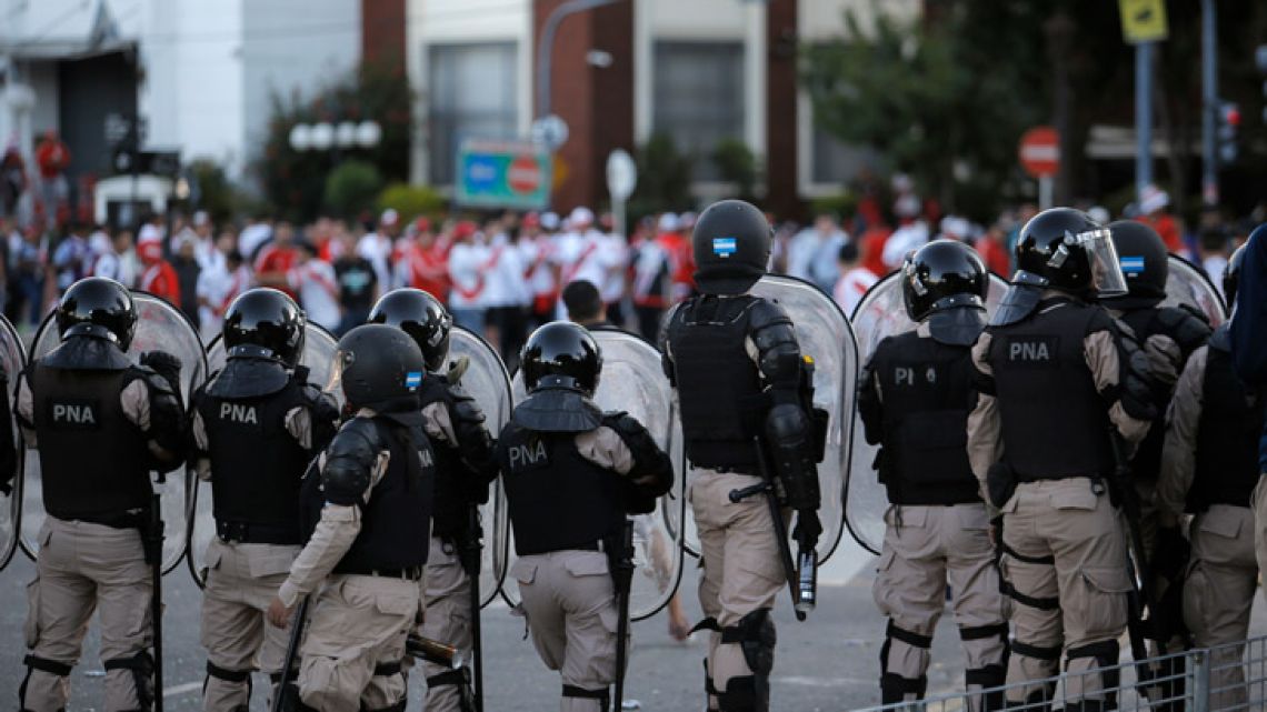 River Plate face riot police outside the Monumental last Saturday.