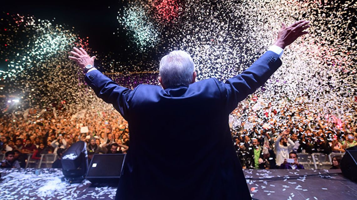 In this July 2018 photo, Andres Manuel López Obrador waves at supporters at Zocalo Square after winning Mexico's general elections.