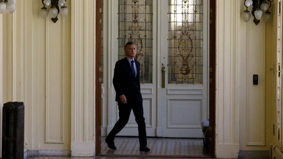 Argentina's President Mauricio Macri arrives for an interview with The Associated Press at the presidential palace in Buenos Aires, Argentina, Monday, Dec. 3, 2018. 
