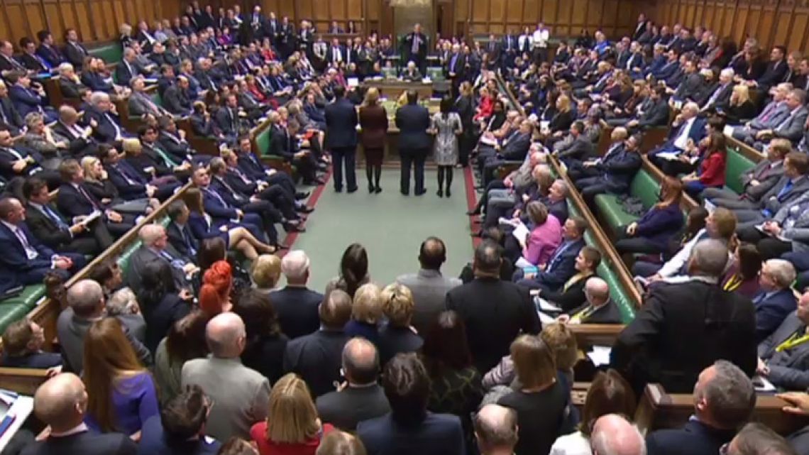 A video grab from footage broadcast by the UK Parliament's Parliamentary Recording Unit (PRU) shows MPs in the House of Commons as the outcome of a vote on an amendment introduced by Conservative MP Dominic Grieve to the timetabling motion for the Brexit deal debate in the House of Commons in London on December 4, 2018 is announced.
