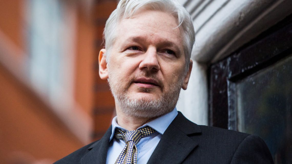 WikiLeaks founder Julian Assange addressing the media from the balcony of the Ecuadorian embassy in February 2016 in central London.