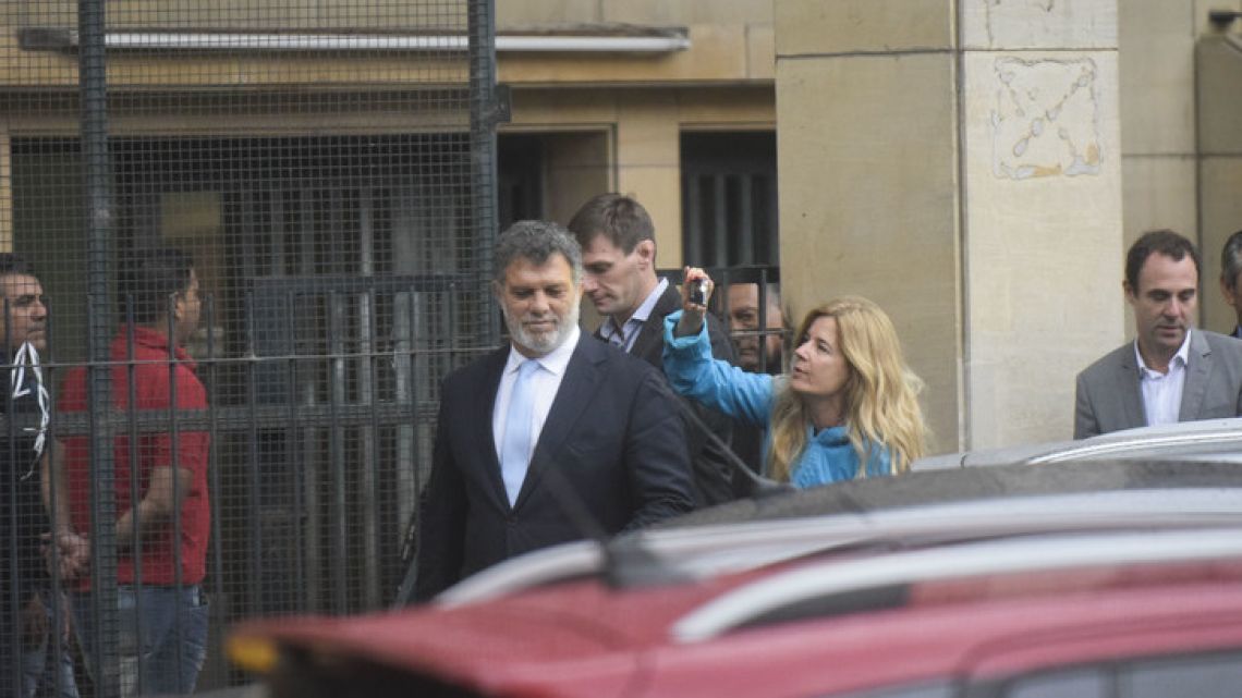 Gianfranco Macri (centre), brother of President Mauricio Macri, leaves the Comodoro Py courthouse in Buenos Aires on Thursday, after handing over a document to Federal Judge Claudio Bonadio.