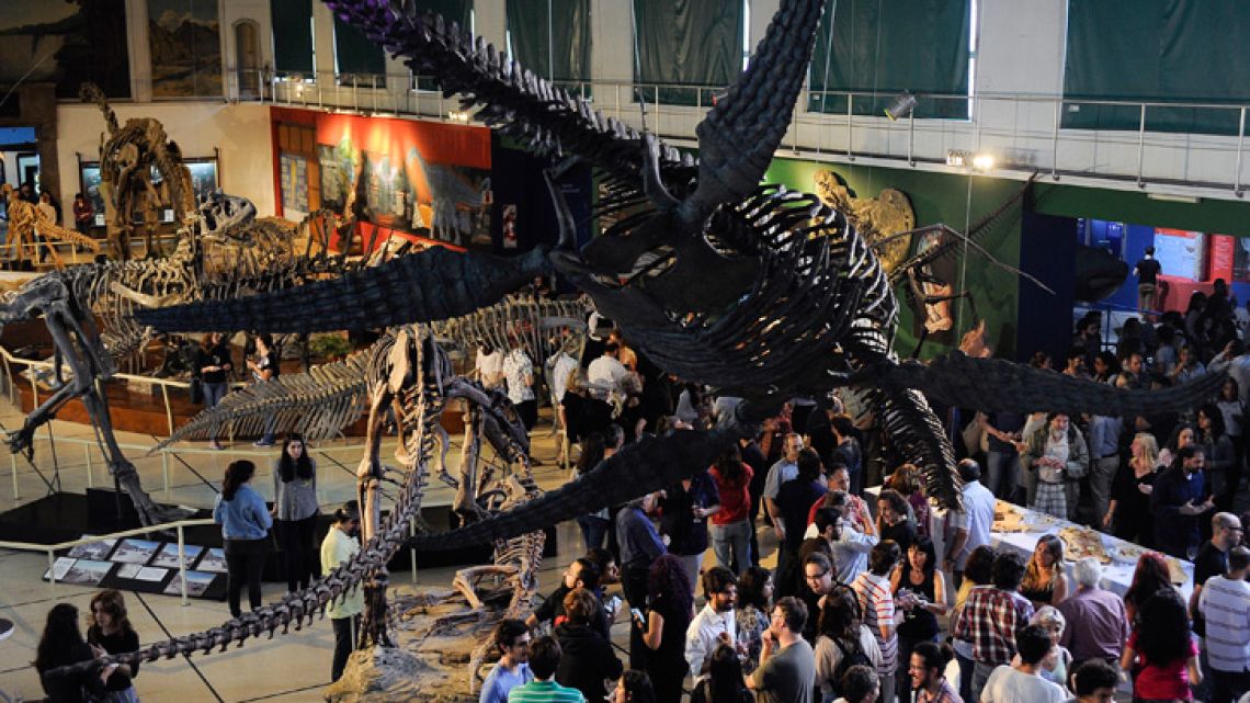 People attend the exhibition inauguration of a skeleton of a giant plesiosaurus (Reptilia, Sauropterygia), an extinct marine reptile discovered in cretaceous rocks near El Calafate, Santa Cruz province.