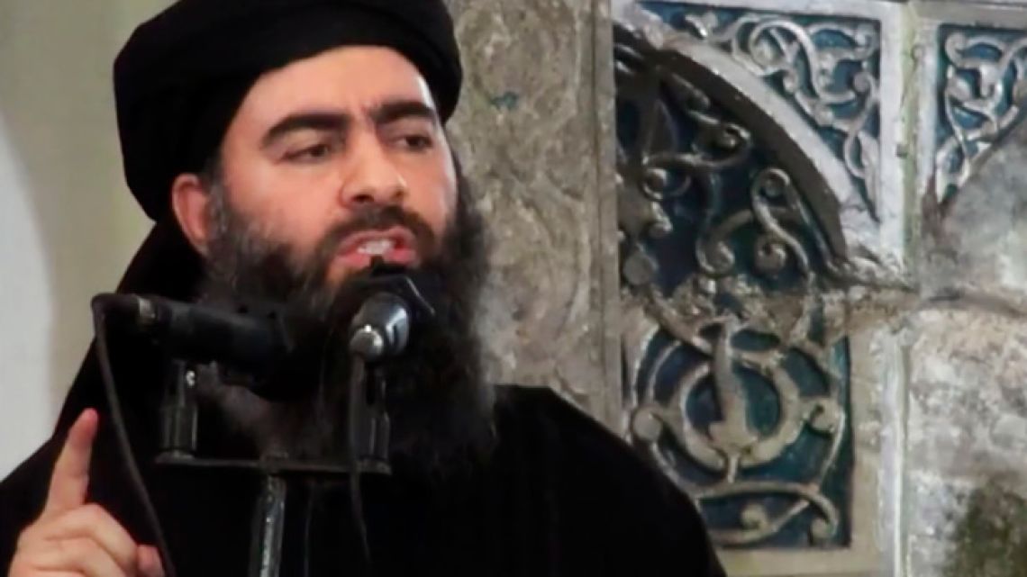 This 2014 image supposedly shows the leader of the Islamic State group, Abu Bakr al-Baghdadi, delivering a sermon at a mosque in Iraq. US President Donald Trump declared victory over the Islamic State group in Syria in a tweet T, but the militants remain a force and its top leaders, including the group's self-styled caliph Abu Bakr al-Baghdadi, remain at large.