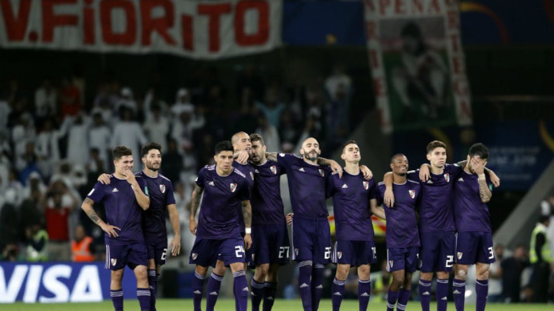 River Plate’s players react after the penalty shoot-out loss in the Club World Cup semi-final against Al Ain Club at the Hazza Bin Zayed stadium in Al Ain, United Arab Emirates.