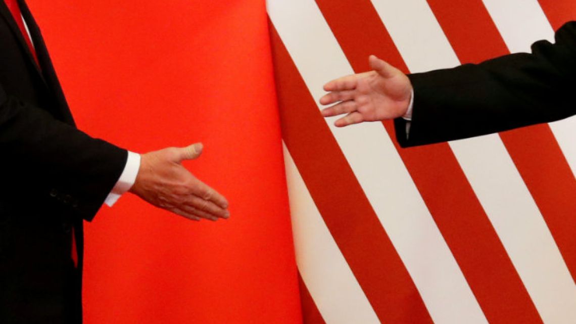 Trump giving a handshake.