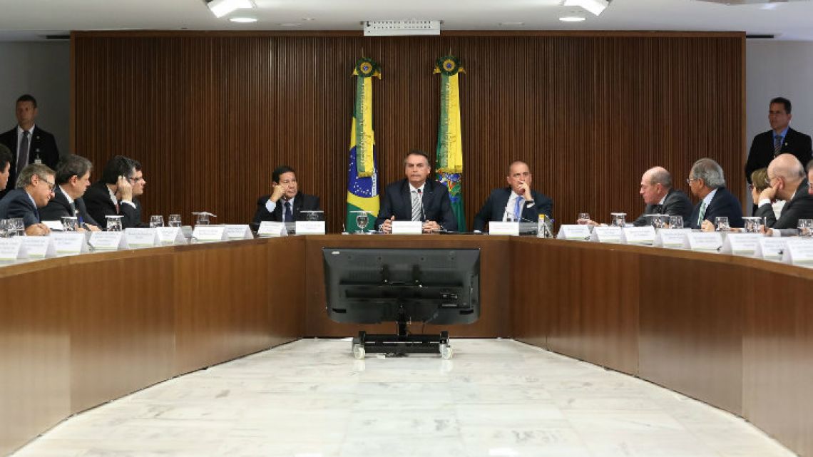 Brazilian President Jair Bolsonaro (centre) attends a ministerial meeting at the Planalto Palace in Brasilia on January 3, 2019. 