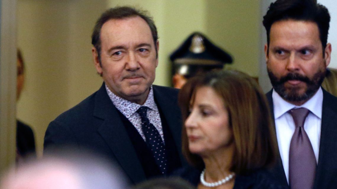 Actor Kevin Spacey enters court with his attorneys Juliane Balliro, front, and Alan Jackson, right, for arraignment on a charge of indecent assault and battery on Monday, January 7, 2019, in Nantucket.