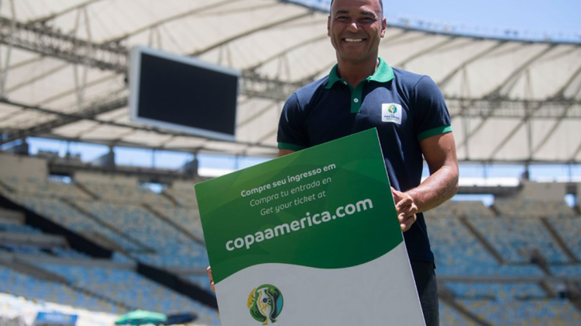 Brazilian former footballer Cafu poses for a picture showing a Copa America 2019 giant ticket after a press conference of the Copa América Local Organisation Committee, at the Maracanã Stadium in Rio de Janeiro.
