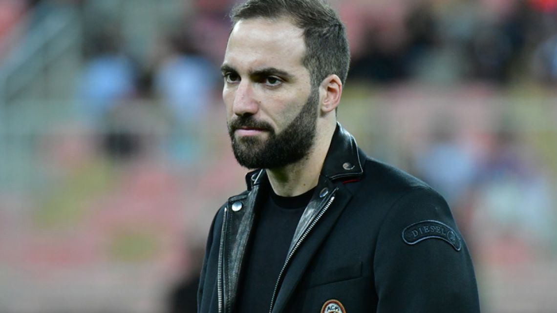 Argentine forward Gonzalo Higuaín is seen on the pitch ahead of Supercoppa Italiana final between Juventus and AC Milan at the King Abdullah Sports City Stadium in Jeddah on January 16, 2019.  