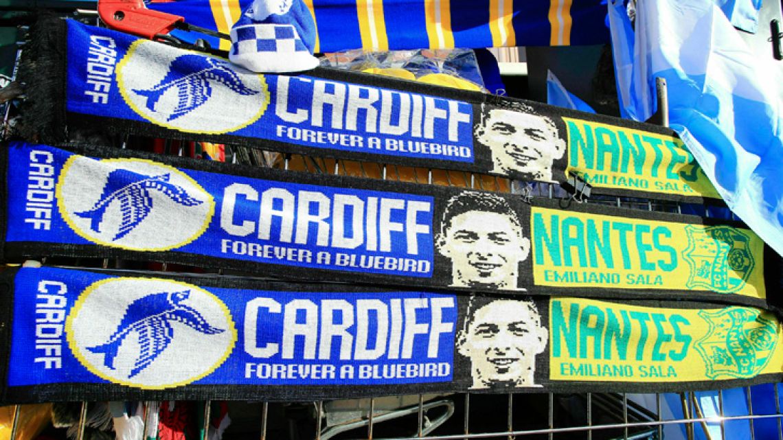 Scarves showing Emiliano Sala's image are sold outside Cardiff City's stadium.