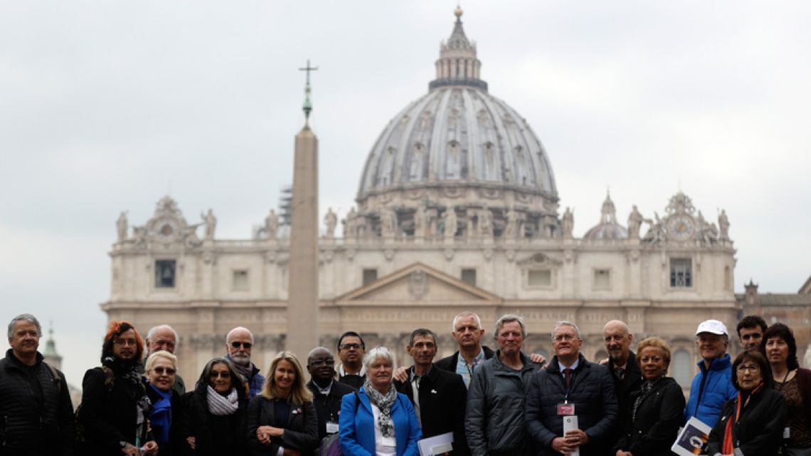 Members of the ECA (Ending of Clergy Abuse) organisation and survivors of clergy sex abuse pose for photographers outside St. Peter's Square, at the Vatican.
