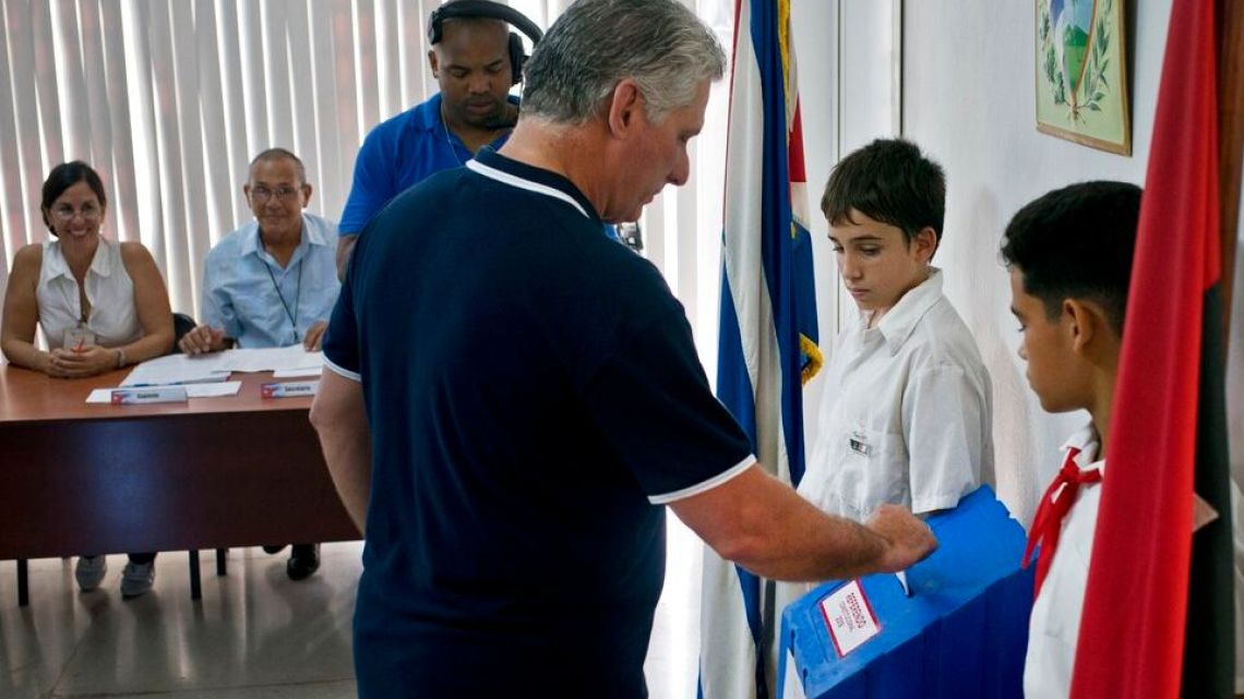 Cuba's President Miguel Diaz-Canel votes during a referendum to approve or reject the new constitution in Havana, Cuba.