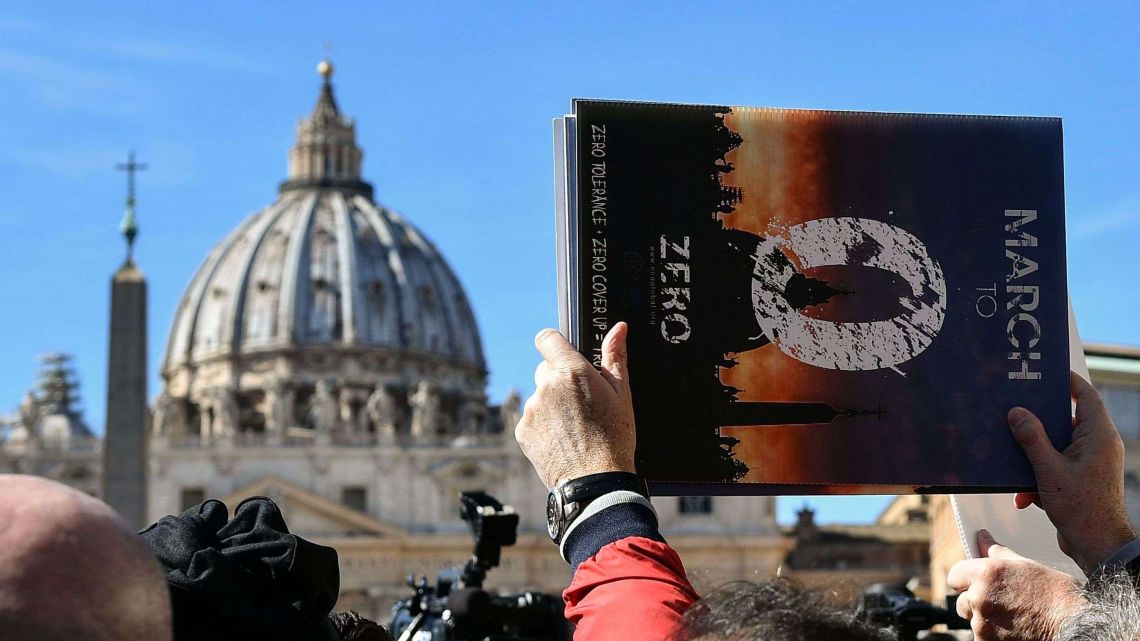 Members of Ending Clergy Abuse (ECA), a global organization of prominent survivors and activists who are in Rome and the Vatican for this week’s papal summit, stand for a protest on St. Peter's Square by St. Peter's basilica on February 24, 2019