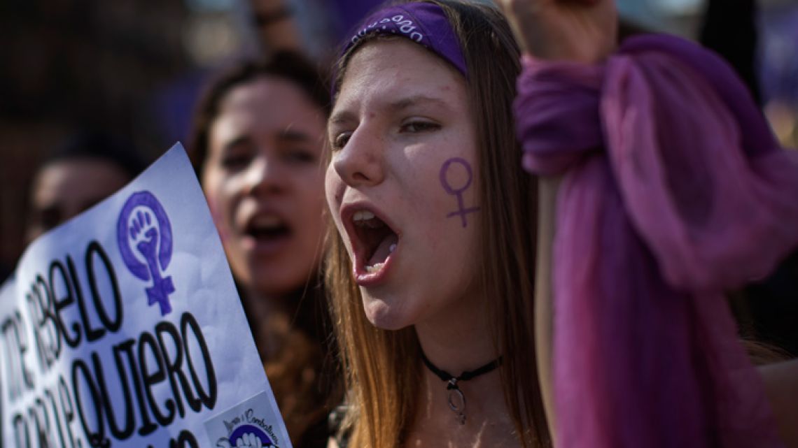 Women march as they shout slogans during the International Women's Day in Barcelona, Spain, Friday, March 8, 2019. Spanish women are marking International Women's Day with a full day strike and dozens of protests across the country against wage gap and gender violence. 