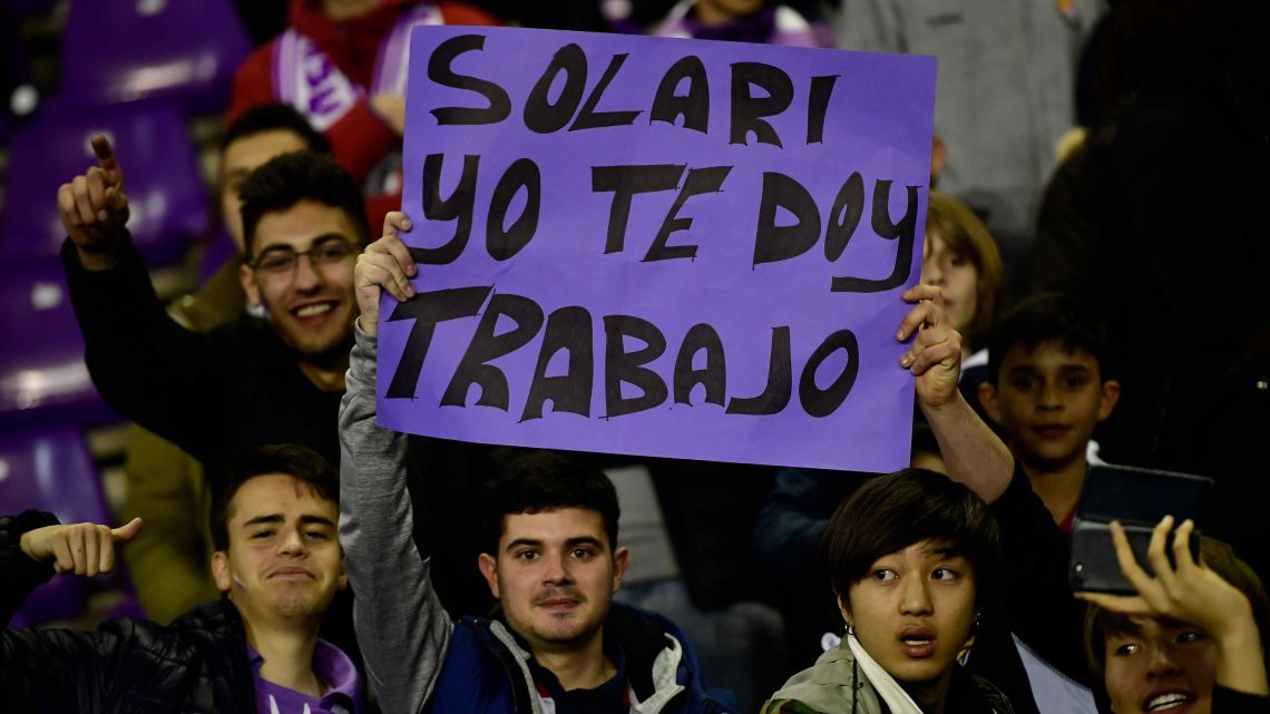 Real Madrid fans holds up a banner that reads: "Solari, I offer you work", to coach Santiago Solari. March 10, 2019 