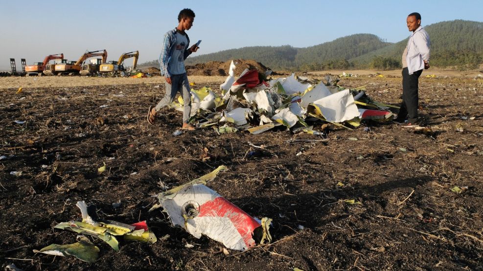 Workers Attend The Crash Site Of Ethiopian Airlines ET302 Flight To Nairobi