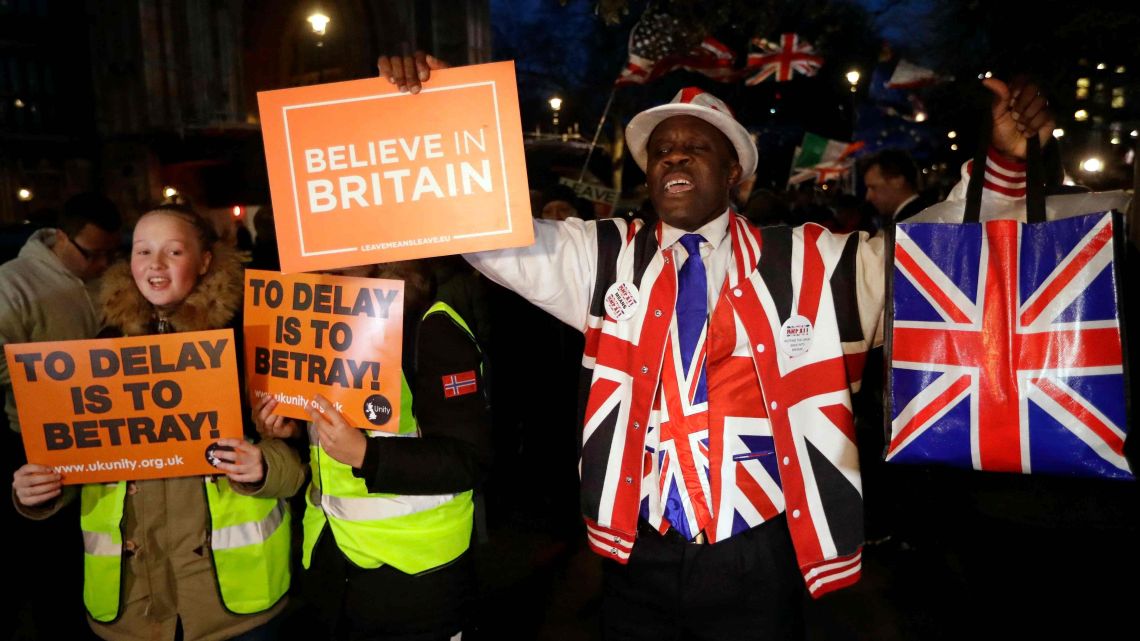 Pro-Brexit leave the European Union supporters react outside the Houses of Parliament in London, Thursday, March 14, 2019.